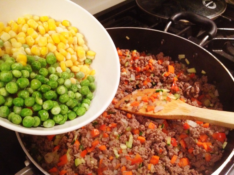 Adding some corn and peas
