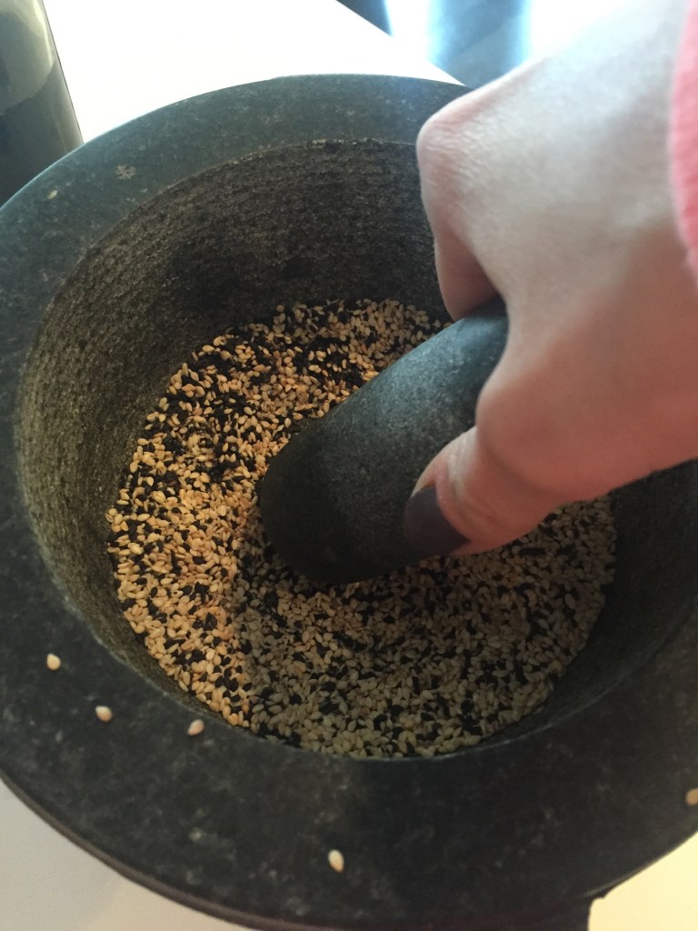 Bash the sesame seeds around